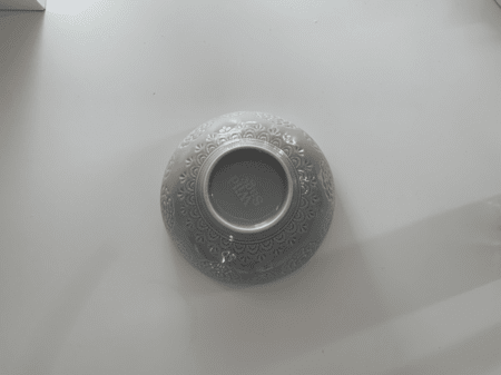 <b>Bowl Bottom</b><br>I used my phone to capture the bottom of the bowl, showcasing its material and craftsmanship details. I chose this object because it is a simple semicircle with unique printed details on the surface.