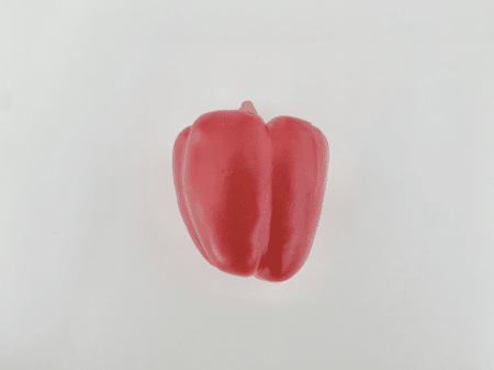 <b>Top View of Red Bell Pepper</b><br>In this photo, I captured a top view of a vibrant red bell pepper using my phone. The smooth surface and bright color stand out against the plain white background, creating a clean and modern look. The lighting highlights the curves and contours of the pepper, enhancing its fresh appearance.