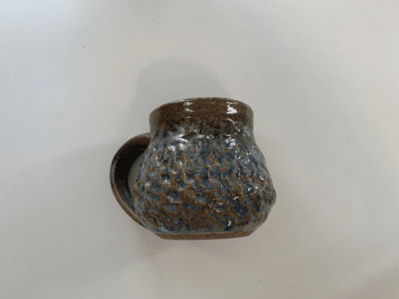 <b>Mug Front</b><br> I photographed the front of the mug with my phone, highlighting the irregular surface texture and shape of the cup. I chose this object because it is a complex irregular cylinder with a unique surface texture.