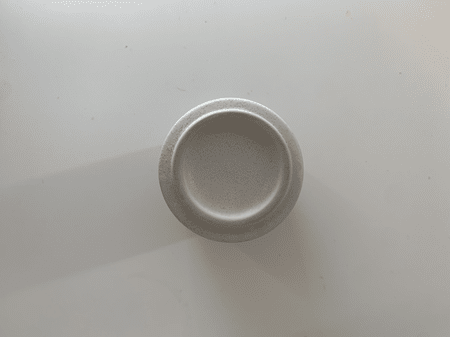 <b>Bottom of the cup</b><br>Using my phone, I photographed the bottom of the cup to highlight its material and the design details on the bottom. I chose this object because it is a simple cylinder with unique printed designs.