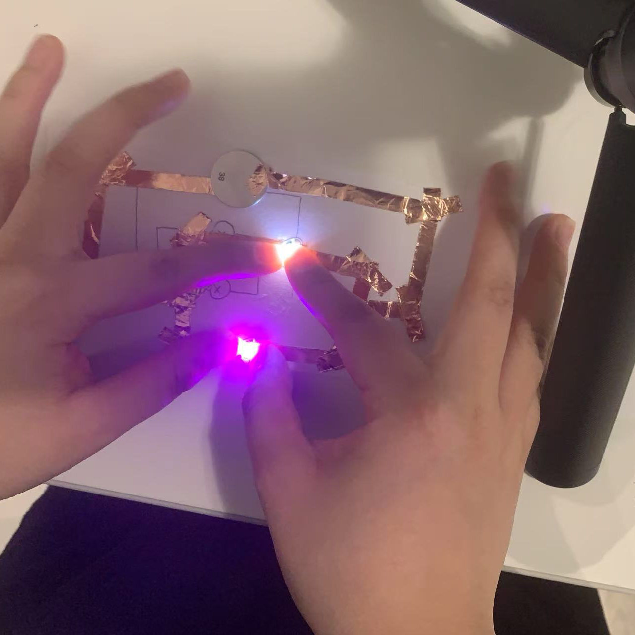 I pressed on the circuit, and both LEDs lit up successfully. It shows the circuit works as intended.