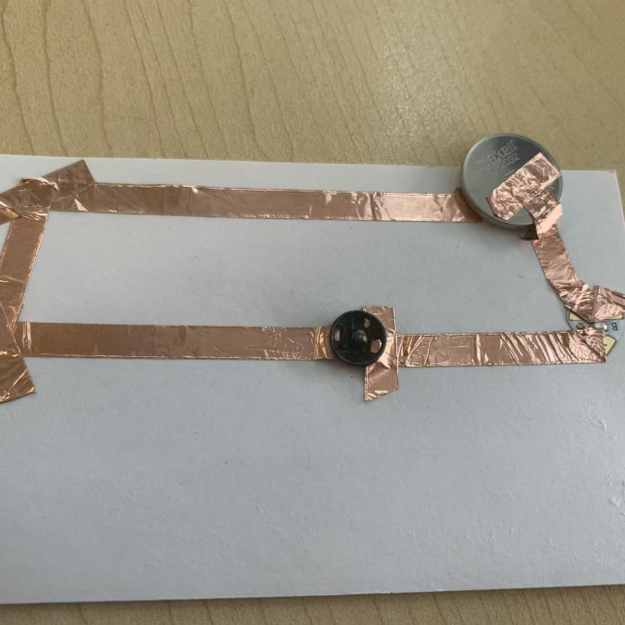 I pressed the circuit to test it, and the LED lit up with a blue glow. It was exciting to see it working successfully.