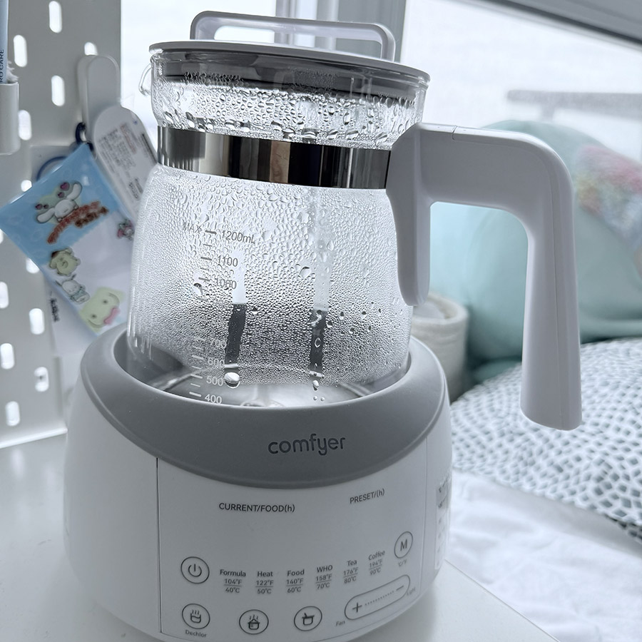 A modern electric kettle showing bubbling water, capturing the alert sound when the water reaches boiling temperature.