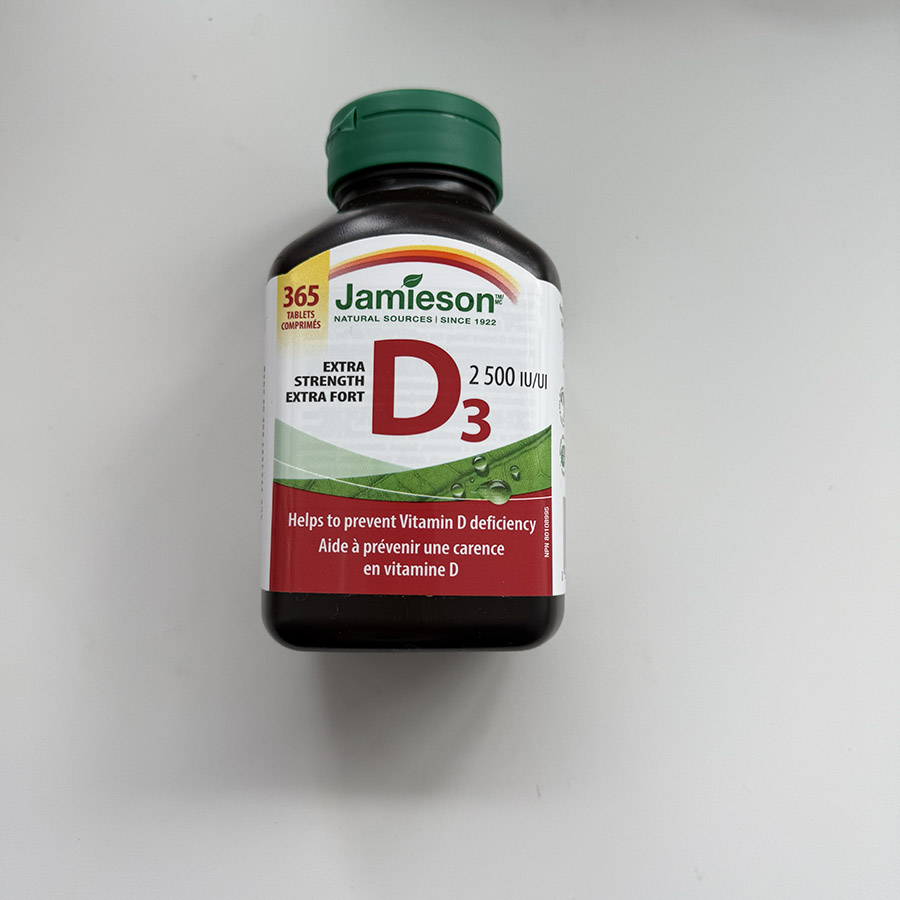 A bottle of vitamin D supplements, symbolizing the rattling sound of pills being shaken out of the bottle.