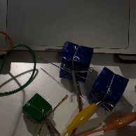 In this demonstration, I am pressing on the gift-wrapped boxes. Each touch triggers different actions on my computer, creating a direct interaction between the physical touch of the boxes and the digital responses on the screen. This experiment shows how everyday objects can be transformed into interactive tools using Makey Makey.