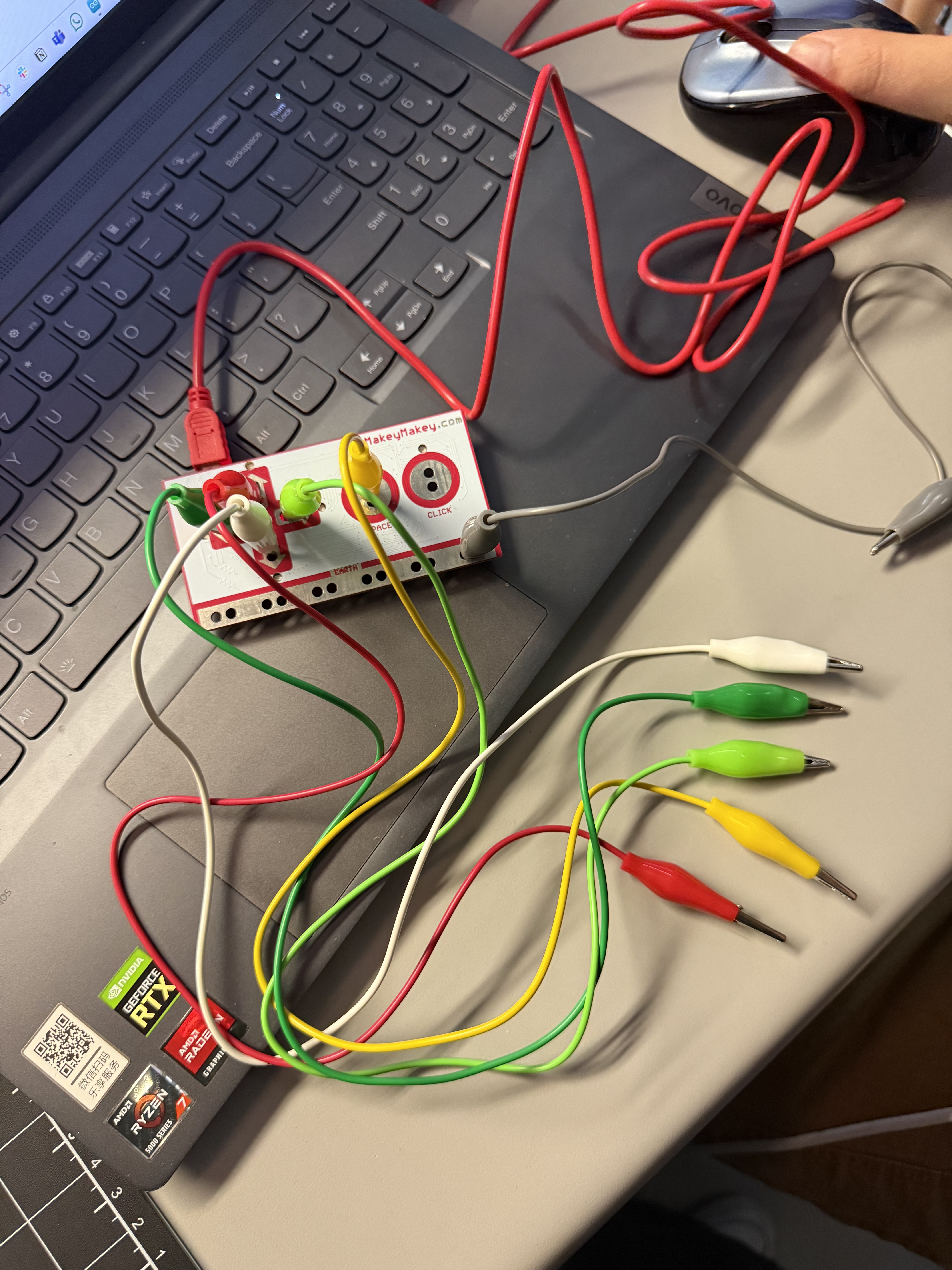 <b>Setting Up the Makey Makey Board</b><br>I arranged alligator clips and connected them to the Makey Makey inputs. Each color wire has a specific function in my test. I checked the connections carefully to make sure the signals could be sent to the computer.